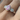 skinny wrists Silver ring with pink gemstone and smaller clear stones on a finger