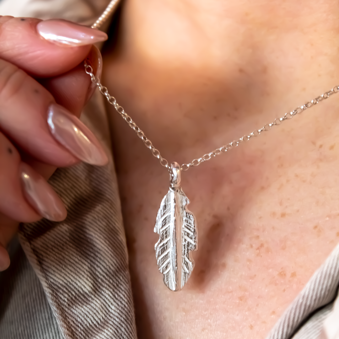 Silver feather necklace discount