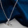 skinny wrists Silver Sagittarius  necklace with a unique pendant on a blue fabric background