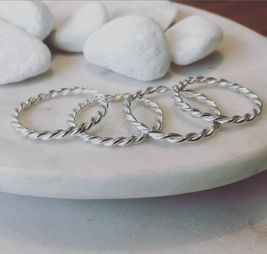 Twisted Stacking Rings